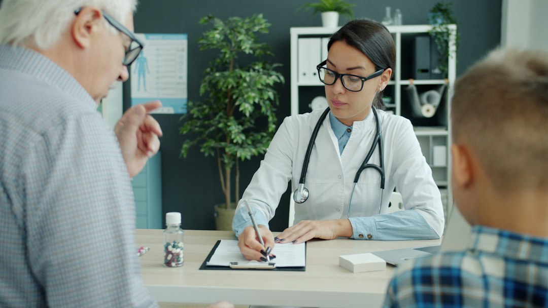 Clinician and patient discussing prior treatment response during an office visit